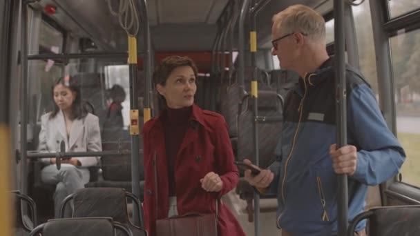 Medium Short Haired Caucasian Woman Wearing Red Trench Coat Holding — Stock Video