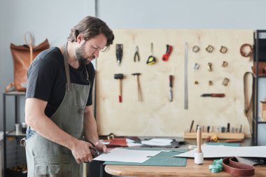 Man Working with Leather clipart