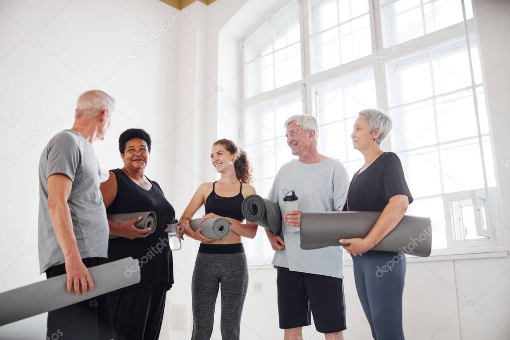 Yoga class standing in studio