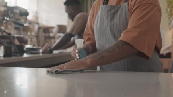 Medium Cropped Waiter Standing Counter Cleaning Surface Blurred Black Man — Stock Video