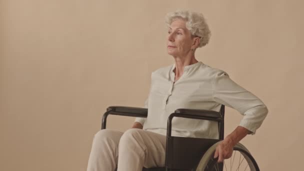 Medium Portrait Caucasian Old Lady Disability Sitting Wheelchair Looking Away — Stock Video