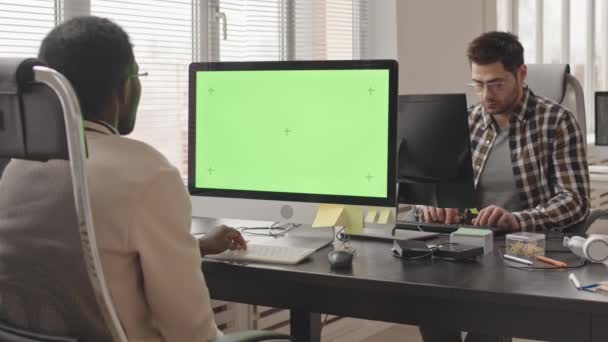 Slowmo Stab Shot Two Young Multiethnic Software Developers Sitting Workplaces — Stock Video