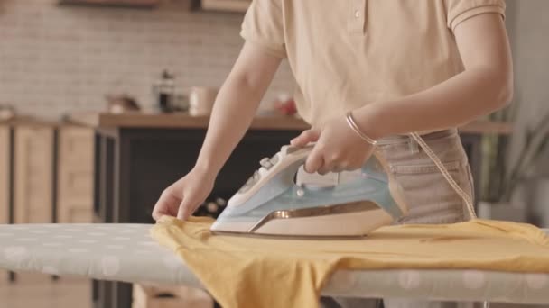 Tilt Medium Close Slowmo Young Asian Woman Ironing Shirt Ironing — Stock Video