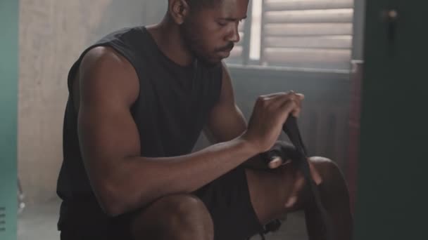 Slowmo Shot Young Muscular African American Boxer Bandaging Hands Black — Stock Video