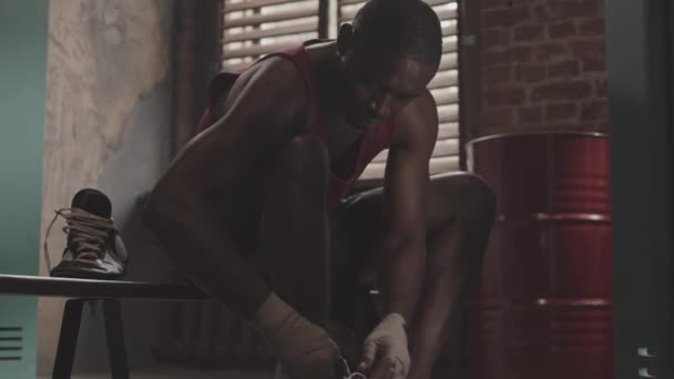 Slowmo Shot Muscular Black Man Wrapped Hands Putting Boxing Shoes — Stock Video