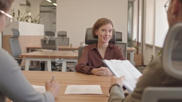 Medium Slowmo Shot Smiling Young Woman Having Job Interview Sitting — Stock Video
