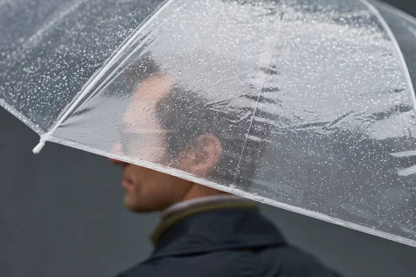 stock image Man Standing Under Transparent Umbrella