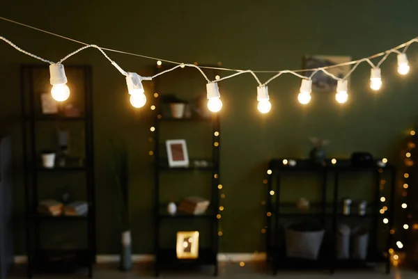 Beautiful room with pastel green walls and shining glowing lights — Stock Photo, Image