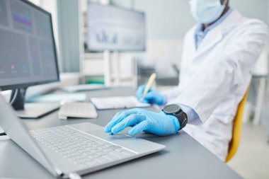 Scientist using laptop in his work