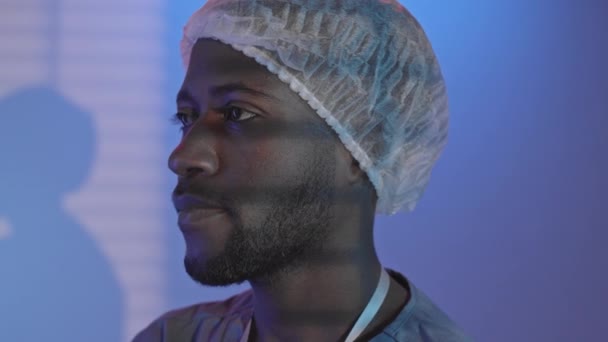 Pan Closeup Portrait Young African American Male Surgeon Uniform Disposable — Stock video