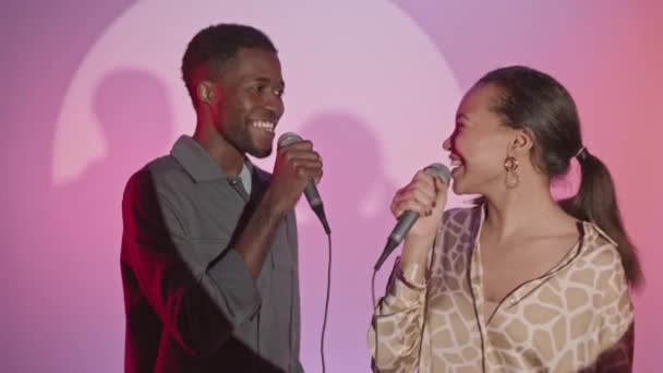 Medium Slowmo Shot Young Happy African American Couple Singing Together — Stockvideo