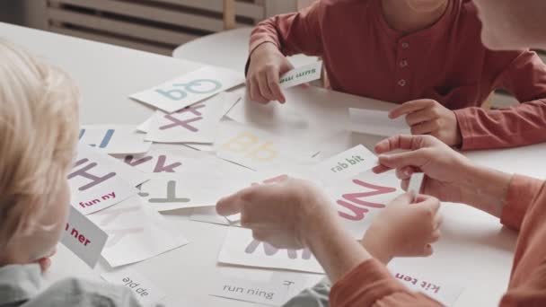 Top View Slowmo Shot Female Speech Therapist Two Elementary Age — Stockvideo