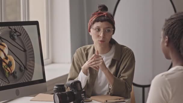 Medium Shot Two Multiethnic Female Photographers Discussing Work Process While — Stok video