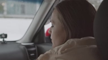 Slowmo close up of young Caucasian woman taking boyfriend hand on transmission in car