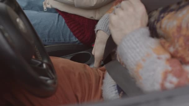 Medium Slowmo Shot Happy Young Caucasian Couple Fastening Seat Belts — Stockvideo