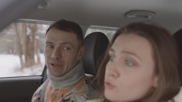 Medium Close Slowmo Cheerful Young Caucasian Couple Singing Songs Car — Stockvideo