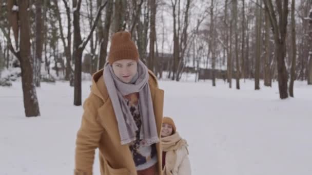 Slowmo Shot Cheerful Man Carrying His Girlfriend Sleigh Having Fun — Vídeo de Stock