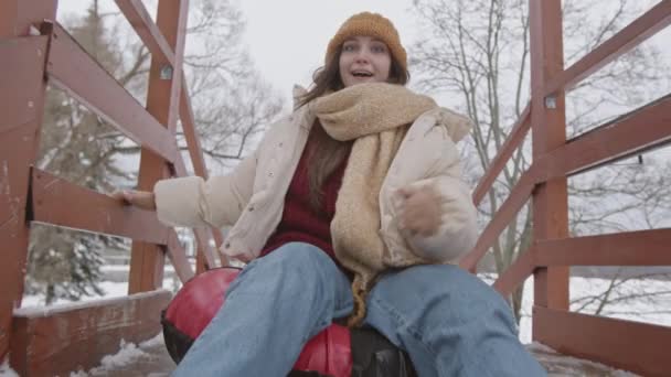 Slowmo Shot Young Caucasian Woman Looking Camera While Riding Slide — Stok video