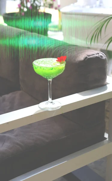 Kiwi Daiquiri, Refreshing Cuban cocktail with green hologram. Summer Color Trends 2022, Attention-grabbing Palettes. Close-up.