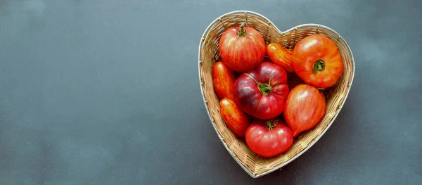 Fresh Red Striped Tomatoes Straw Basket Made Shape Heart Blue — Foto Stock