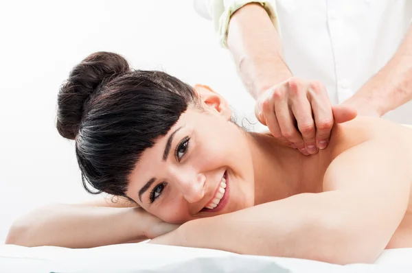 Happy smilling female getting a massage — Stock Photo, Image