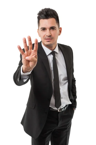 Homem de negócios mostrando número quatro — Fotografia de Stock