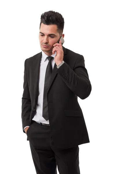 Joven y moderno hombre de negocios hablando en su teléfono inteligente — Foto de Stock