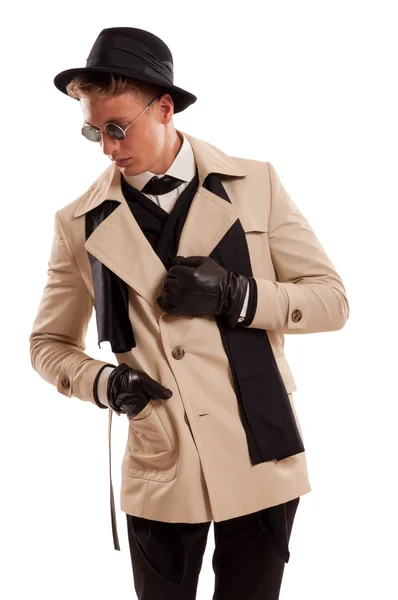 Elegant detective posing on a white backgroun — Stock Photo, Image