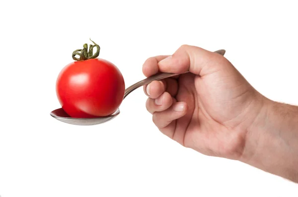 Perfect tomato in an iron spoo — Stock Photo, Image