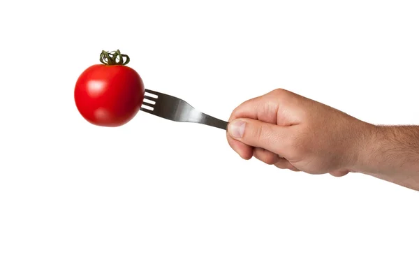 Ręka, widelec i tomat — Zdjęcie stockowe