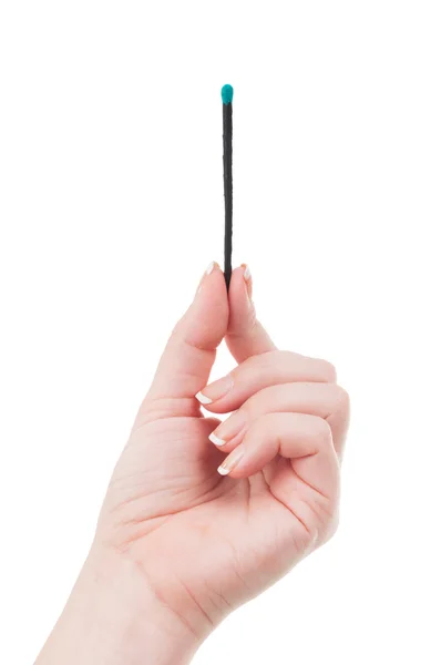 Female hand holding a match — Stock Photo, Image