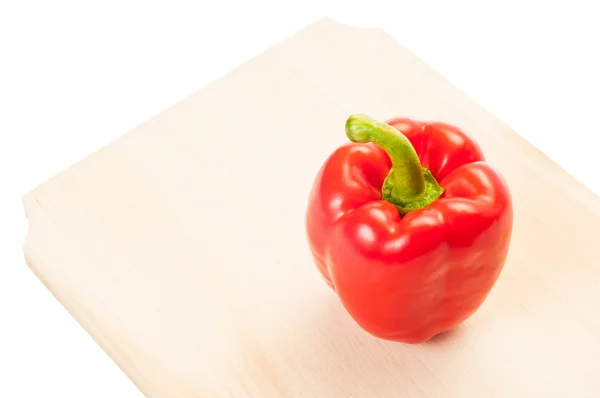 Red pepper on a wooden boar — Stock Photo, Image