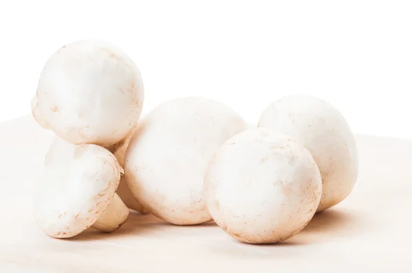 Fresh and clean champignon mushrooms on wooden boar — Stock Photo, Image