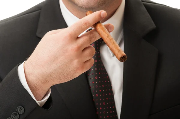 Hombre de negocios sosteniendo una ciga cubana —  Fotos de Stock