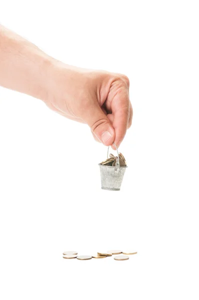 Hand holding a small bucket of coin — Stock Photo, Image