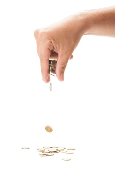 Hand dropping a bunch of coin — Stock Photo, Image