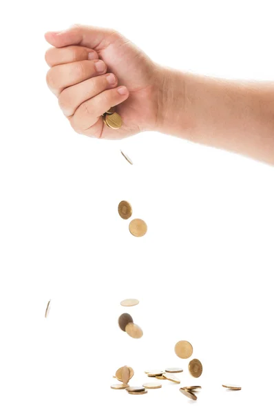 Hand dropping a bunch of golden coin — Stock Photo, Image