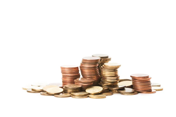 Piles of coins on white tabl — Stock Photo, Image