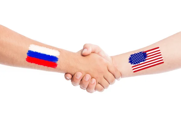 Rusya ve ABD bayrakları sallayarak elleri — Stok fotoğraf
