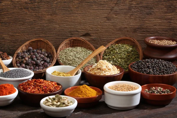 Different spices over a wood background. — Stock Photo, Image