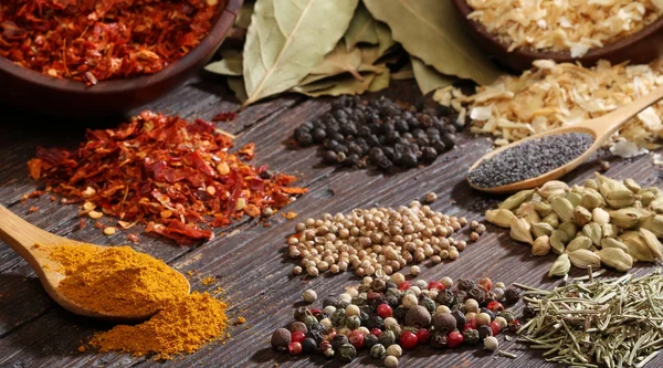 Different spices over a wood background. — Stock Photo, Image