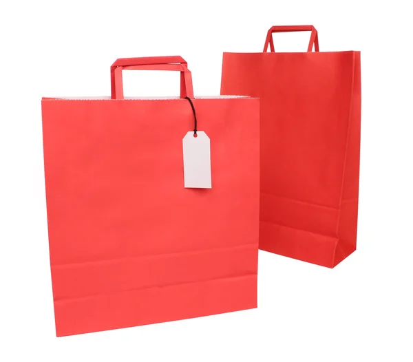 Dois sacos de compras de papel vermelho sobre branco — Fotografia de Stock