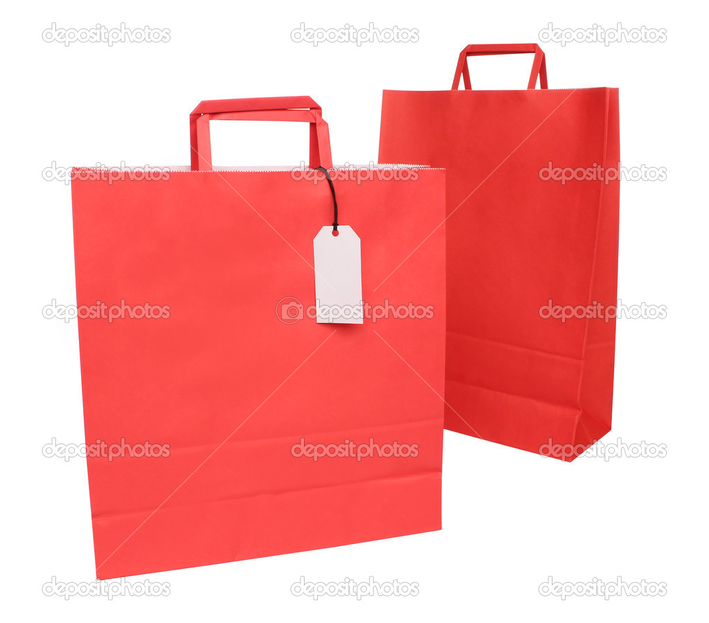Two red paper shopping bags over white