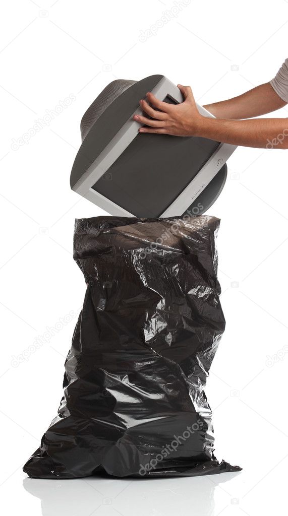 Man throwing a pc monitor in the garbage bag