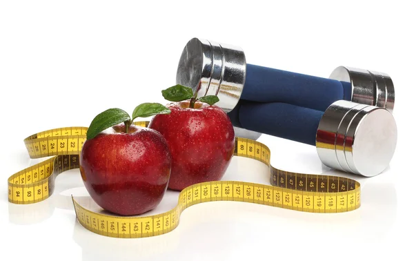 Red apples and a measuring tape over white — Stock Photo, Image