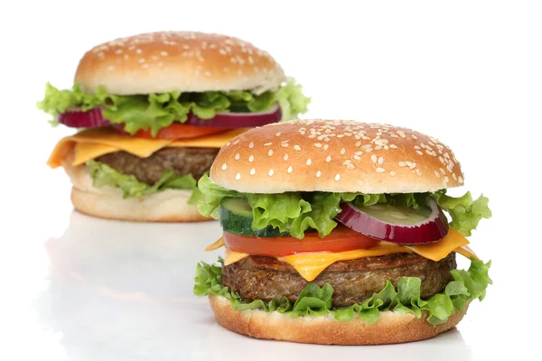 Два смачні гамбургери ізольовані на білому тлі — стокове фото