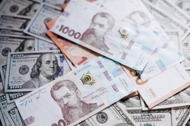 Dollar banknotes of the USA. Amerikan dollars. Money of USA and Ukrainian hryvnia. 1000 Ukrainian hryvnia