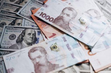 Dollar banknotes of the USA. Amerikan dollars. Money of USA and Ukrainian hryvnia. 1000 Ukrainian hryvnia
