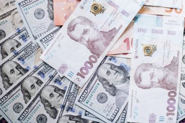 Dollar banknotes of the USA. Amerikan dollars. Money of USA and Ukrainian hryvnia. 1000 Ukrainian hryvnia