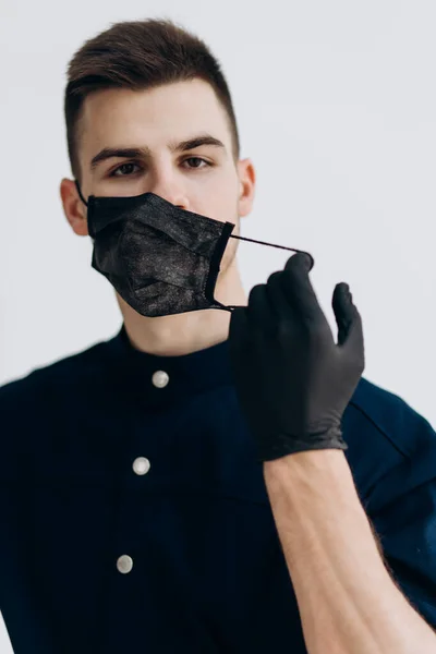 Male Doctor Black Gloves Puts Mask Covid — ストック写真